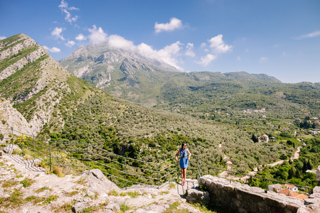 joyful woman travel mountains. Travelling Europe wiith picturesque view. Montenegro.の写真素材