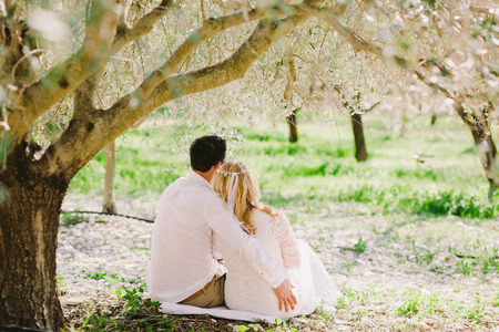 wedding couple embrace under the tree. Fine art style.の写真素材