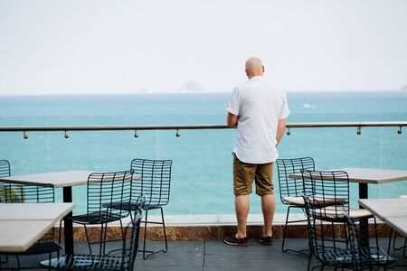 man relax in cafe with sea view. Blue skyの写真素材