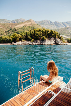 sexy woman relax on yacht in sea. Beautiful seascapeの写真素材