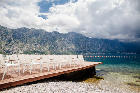 wedding chairs with flowers decoration. Wedding venue ceremony.の写真素材