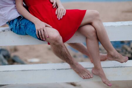 couple hug on beach together. Hands close upの写真素材