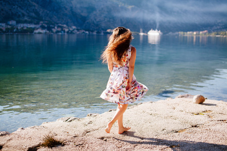 romantic woman walk on beach. Asian beach and sea view.の写真素材