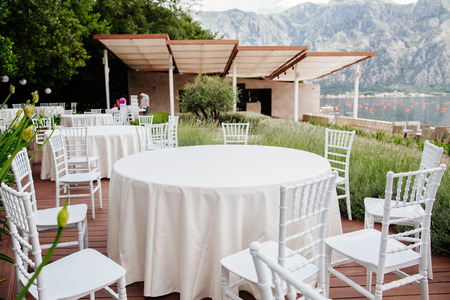 wedding chairs with flowers decoration. Wedding venue ceremony.の写真素材