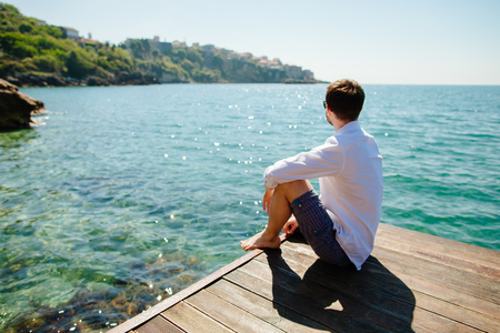 man relax on beach with sea view. Montenegro.の写真素材