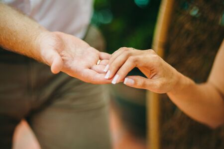 lovely couple holding hands together. Close up shot