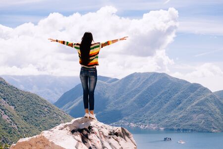 joyful woman travel mountains. Travelling Europe wiith picturesque view. Montenegro.の写真素材