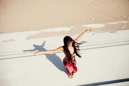 sexy long hair woman relax on beach. Wind in hair and motion. Top view.の写真素材