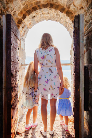 mother with children travel beach. Picturesque sea view.の写真素材