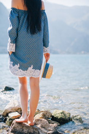 romantic woman walk on beach. Asian beach and sea view.の写真素材