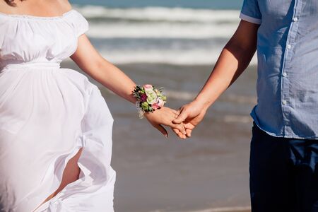 lovely couple holding hands together. Close up shot