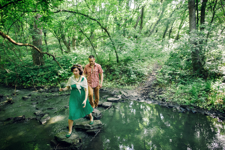 vintage love story couple. Retro style engaged couple at country side.の写真素材