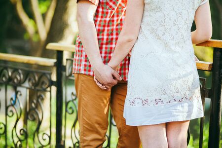 lovely couple holding hands together. Close up shotの写真素材