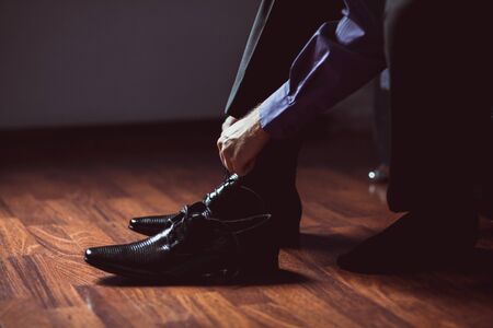 man wearing shoes. Man getting dressed.の写真素材