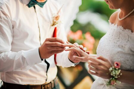 wearing wedding rings ceremony.hands close up