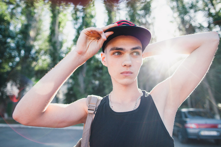 hip hop teenage man. Teenager relax on street in cap.の写真素材