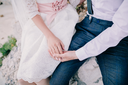 bride and groom holding hands together. Fine art styleの写真素材