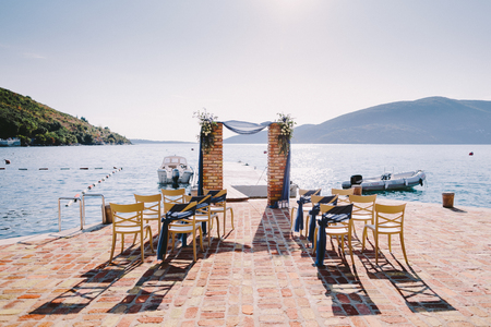wedding arch decoration with sea view. Arch made of bricks.の写真素材
