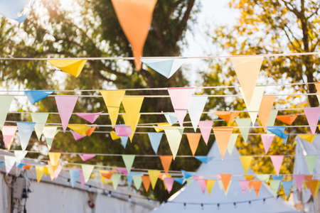 colourful flags decoration in summer campの写真素材