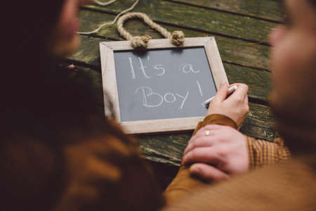 pregnant woman with boy baby signの写真素材