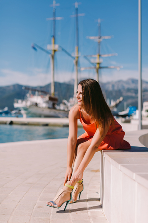 sexy woman wearing shoes on beachの写真素材