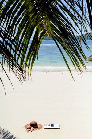 laptop and smartphone on beach. working and travelling on beach. remote and freelance working in tropics.の写真素材