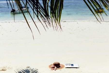 laptop and smartphone on beach. working and travelling on beach. remote and freelance working in tropics.の写真素材