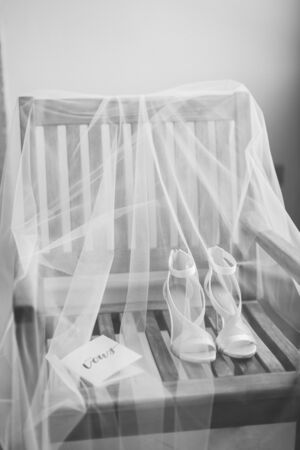 wedding shoes and veil background. Wedding shoes and wedding vow with veil background. Black and white.の写真素材