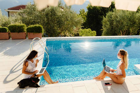 girls using laptop and work remotely on social distanceの写真素材