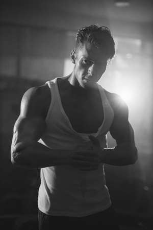 portrait of Powerful Muscular brutal man in darknessの写真素材