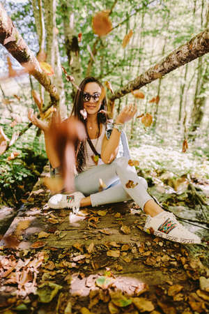 woman relax in autumn forestの写真素材