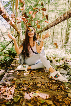 woman relax in autumn forestの写真素材