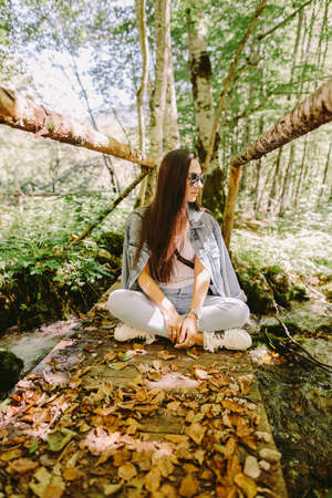 woman relax in autumn forestの写真素材