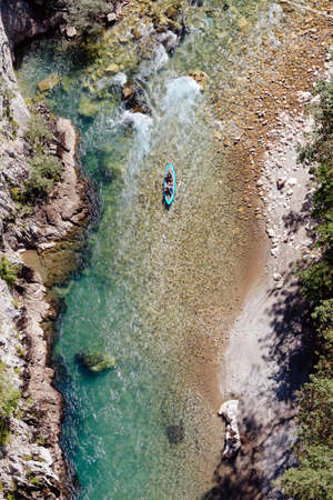 men canoeing in riverの写真素材