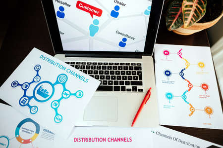 marketing distribution channels plan on office desk of marketing managerの写真素材