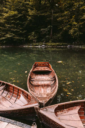 autumn lake with boatsの写真素材