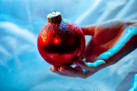 woman holding new year ball ornament decoration