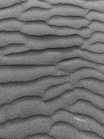 abstract black sand background. dark sand wavesの写真素材