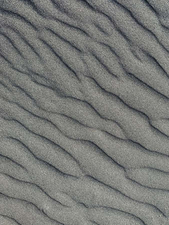 abstract black sand background. dark sand wavesの写真素材