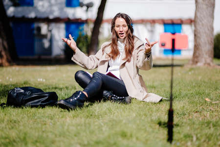 woman tutoring online and explain something using smartphoneの写真素材
