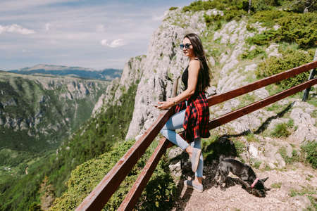 attractive woman relax in mountains with amazing viewの写真素材
