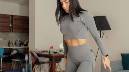 Fitness workout exercises online woman at home. Online fitness courseの写真素材