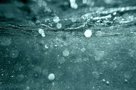 underwater bokeh tidewater green backgroundの写真素材