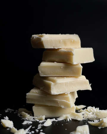 white chocolate on black backgroundの写真素材