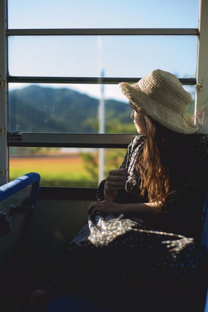 Woman looking at the scenery in the bus