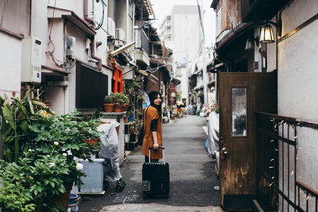 Woman traveling with carry bagの写真素材