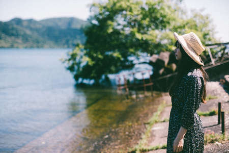 The Woman in the Straw Hat by the Water
