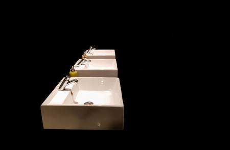 wash basins in black background