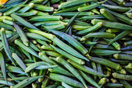 heap of green ladies finger in retail vegetable super market for salecの写真素材