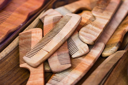 wooden combs on a wooden table. Vintage cosmetic accessoryの写真素材